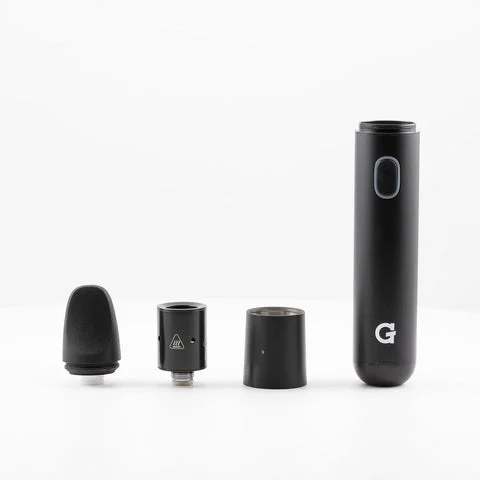 Disassembled black vape pen with four components laid out in a row, including mouthpiece, heating chamber, connector piece, and battery body with a power button and “G” logo.